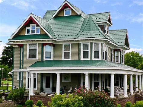 images of houses painted green with red metal roofs|green house with metal roof.